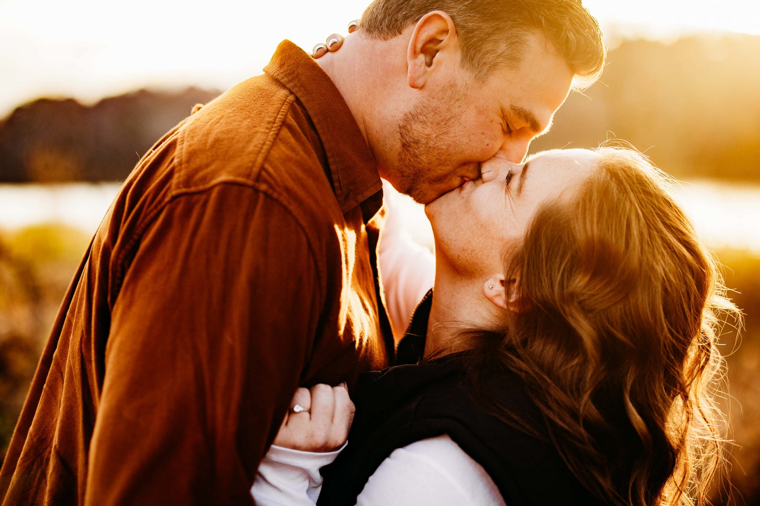 Couple kiss during their We got silly, shook things up (mostly cans of Coors) and had a blast during their Ravine Regional Park engagement shoot.