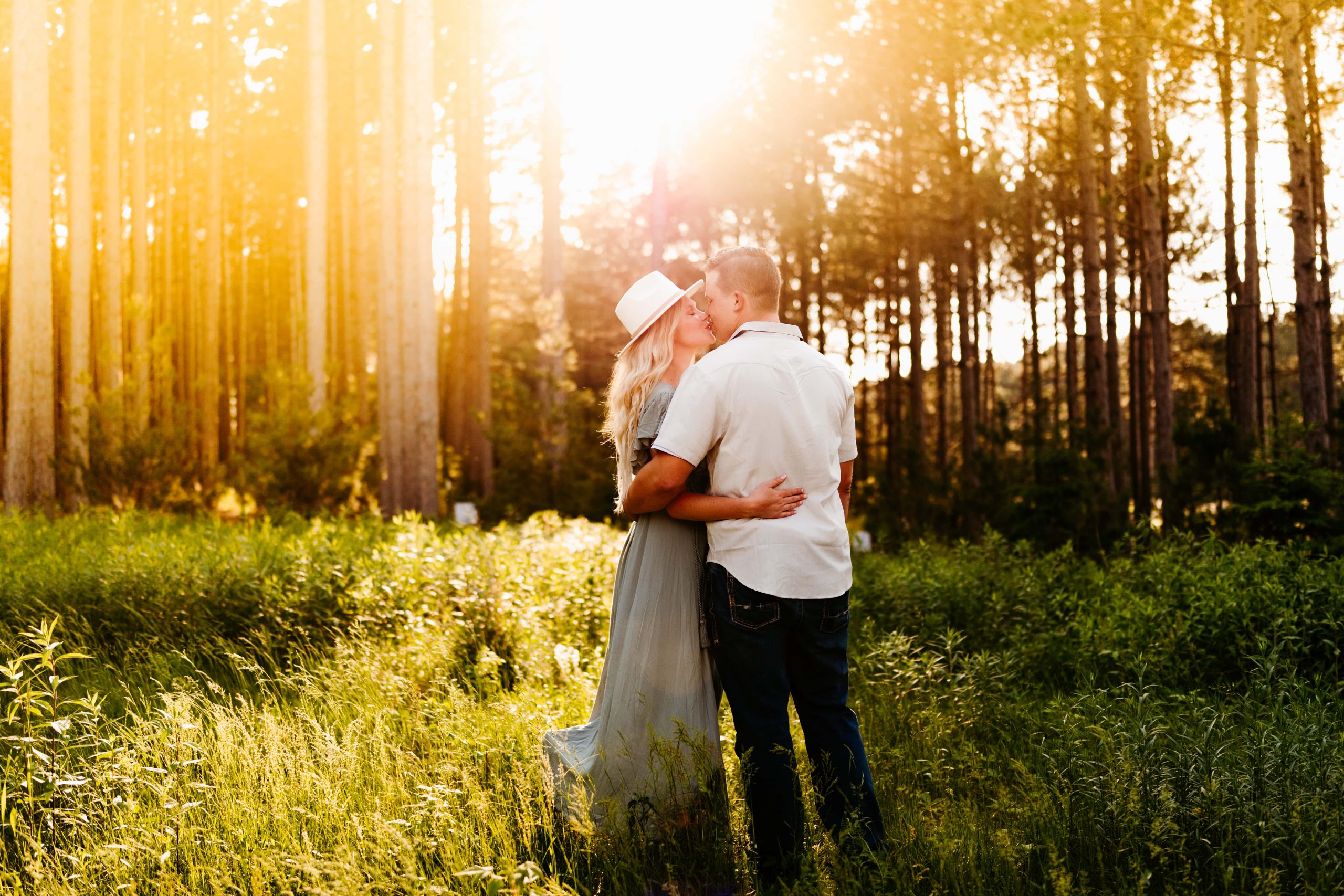 Couple kisses at their Pinewood weddings engagement session