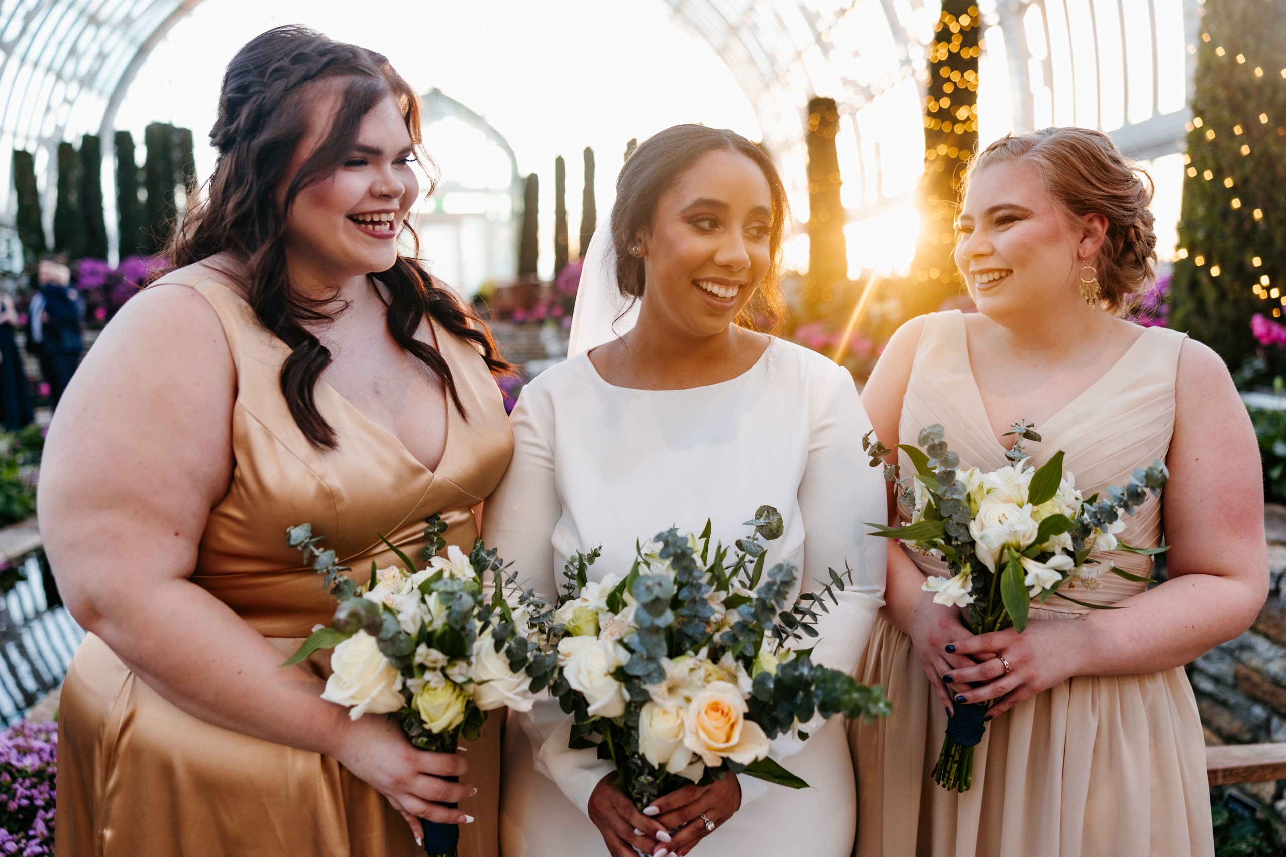 A bride smiles with her bridesmaids during a quiet time as part of her 10-hour wedding timeline