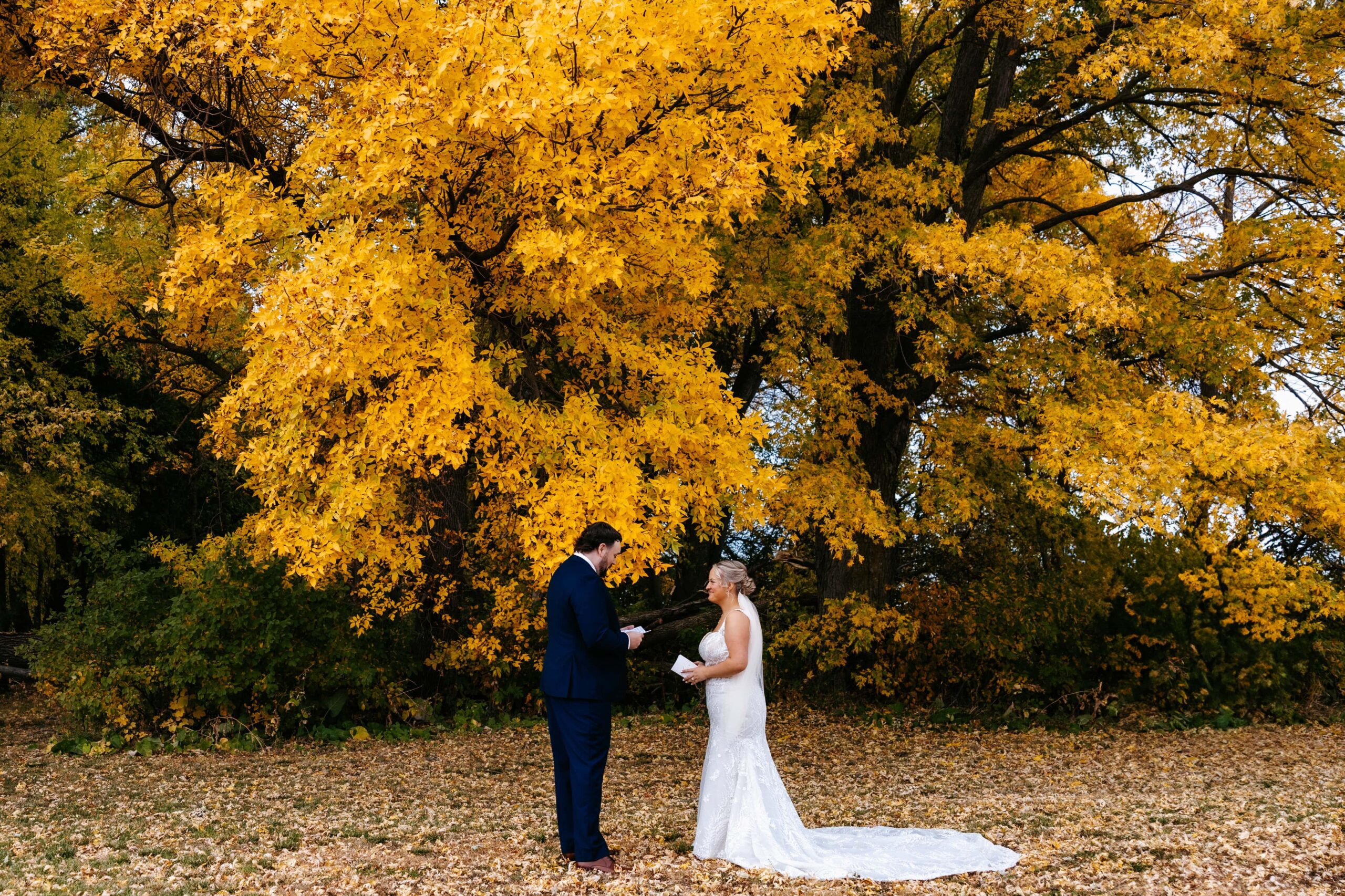 Bride and groom exchange vows in front of their mankato wedding photographer